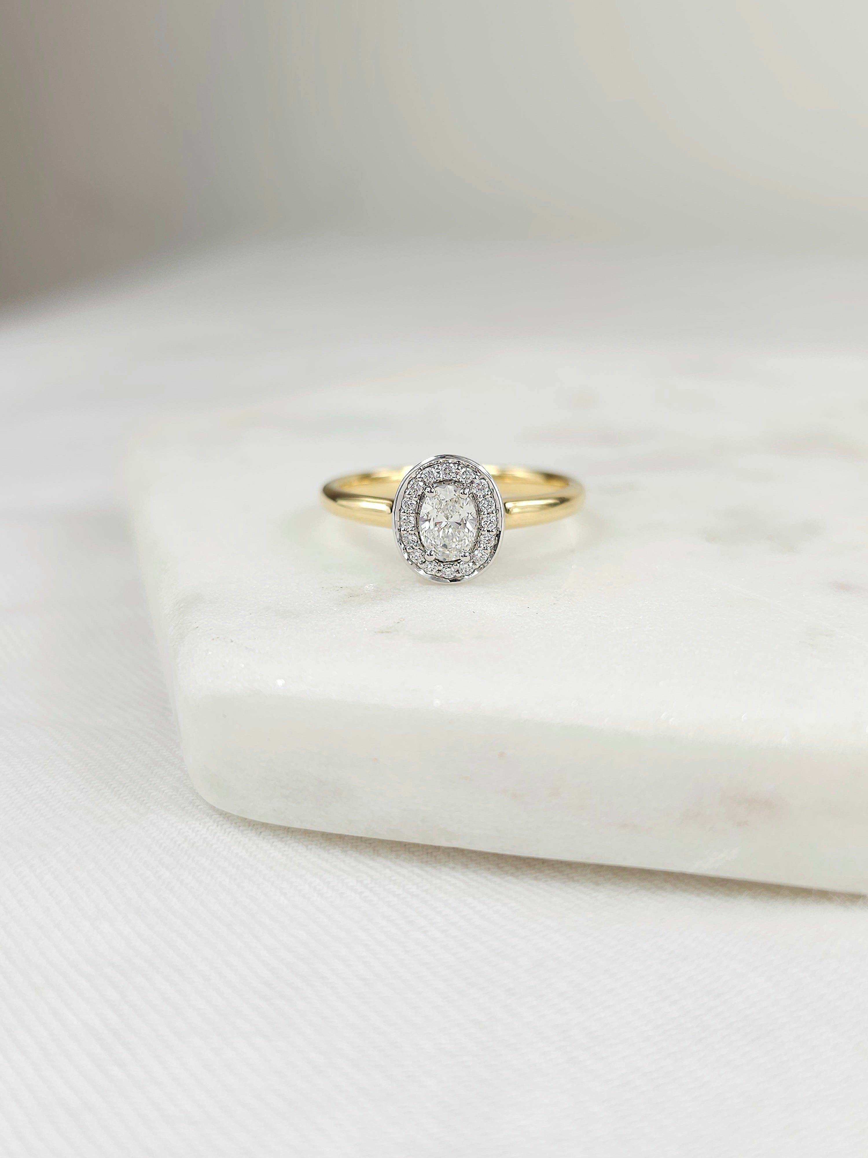 18ct Yellow and White Gold Oval Halo engagement ring, 0.30ct centre