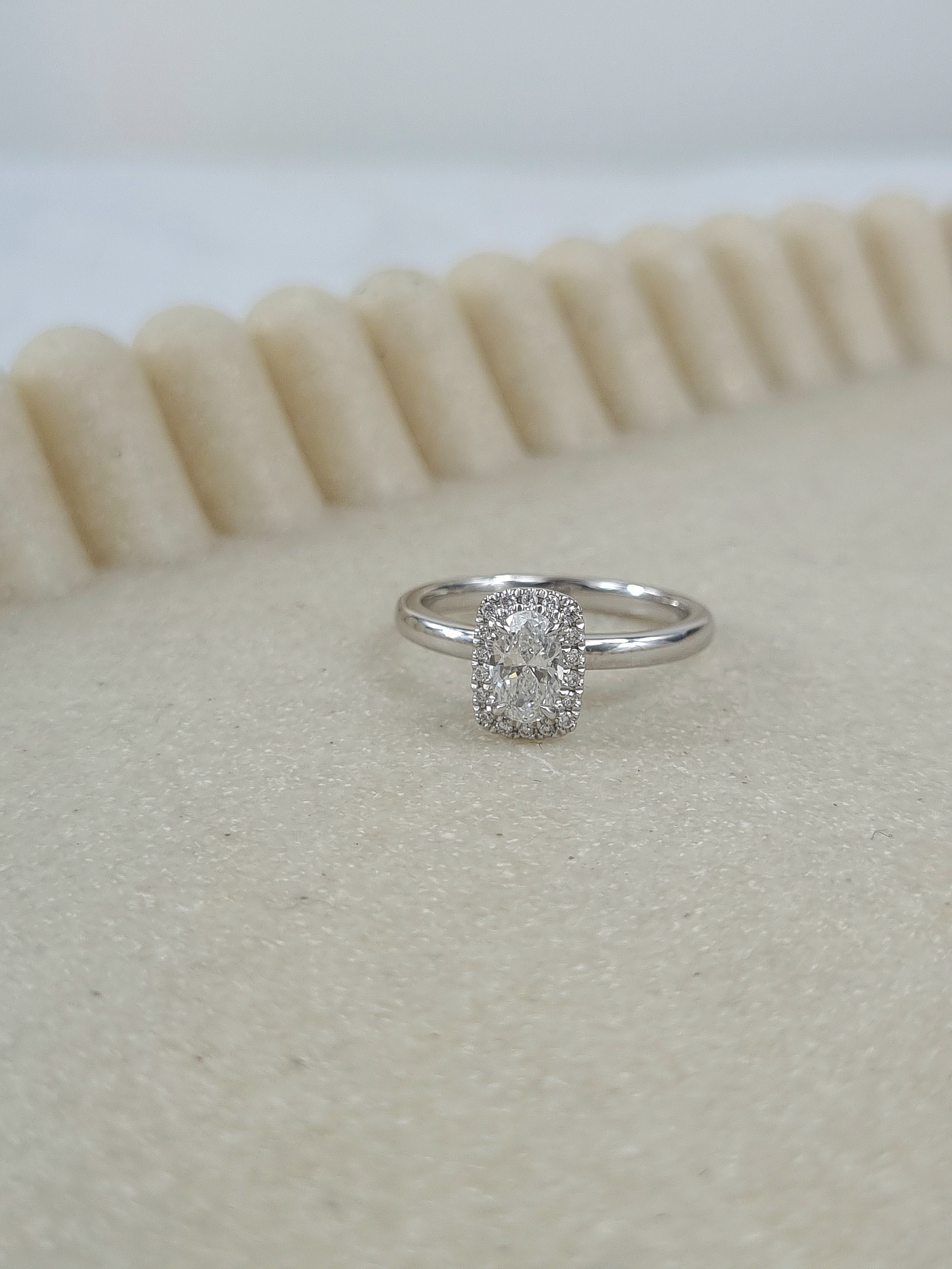 18ct White Gold 0.58ct Oval Cushion-Halo Engagement Ring, 0.50 carat centre.