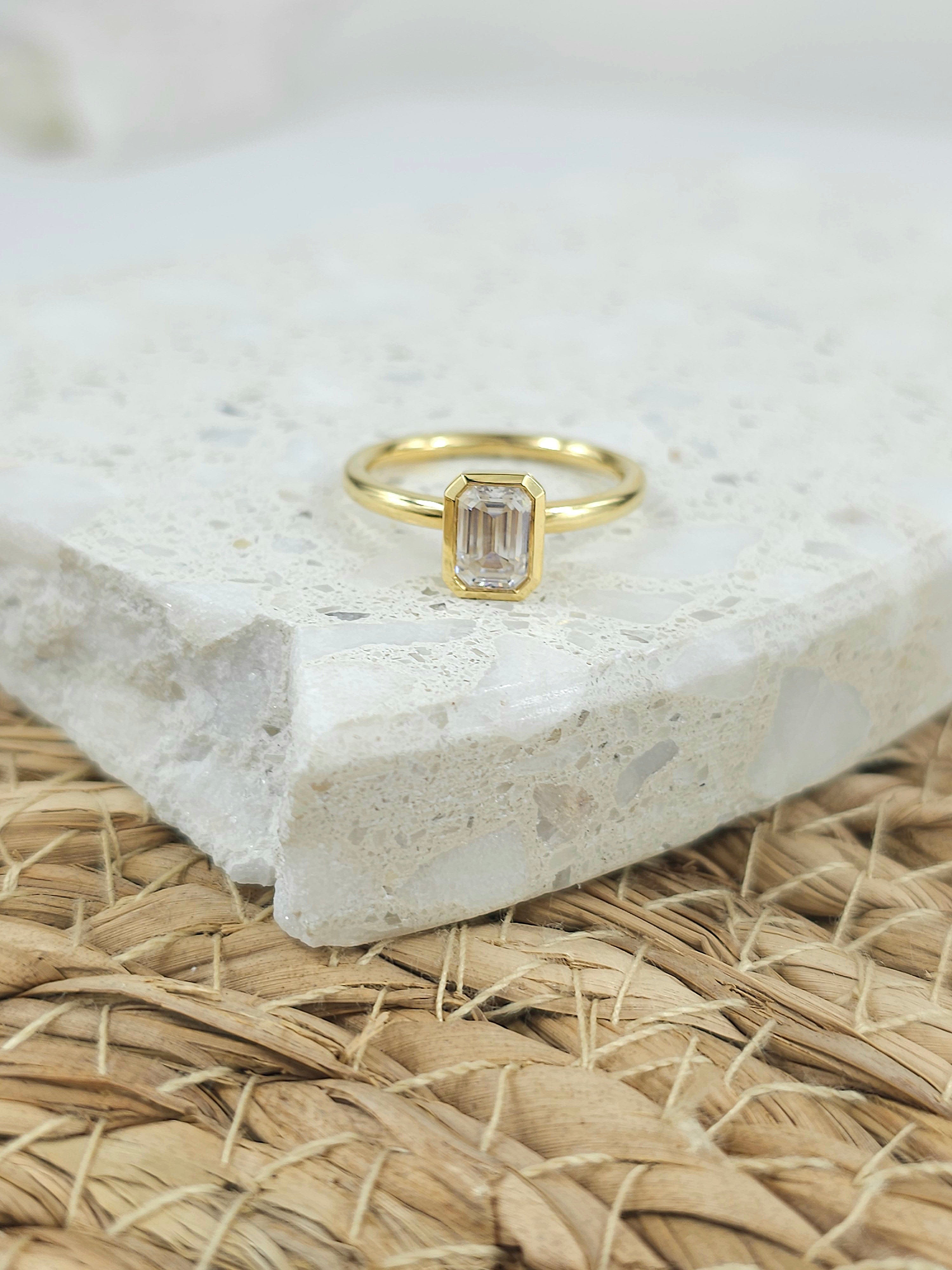 18ct Yellow Gold Emerald Cut Moissanite Solitaire.